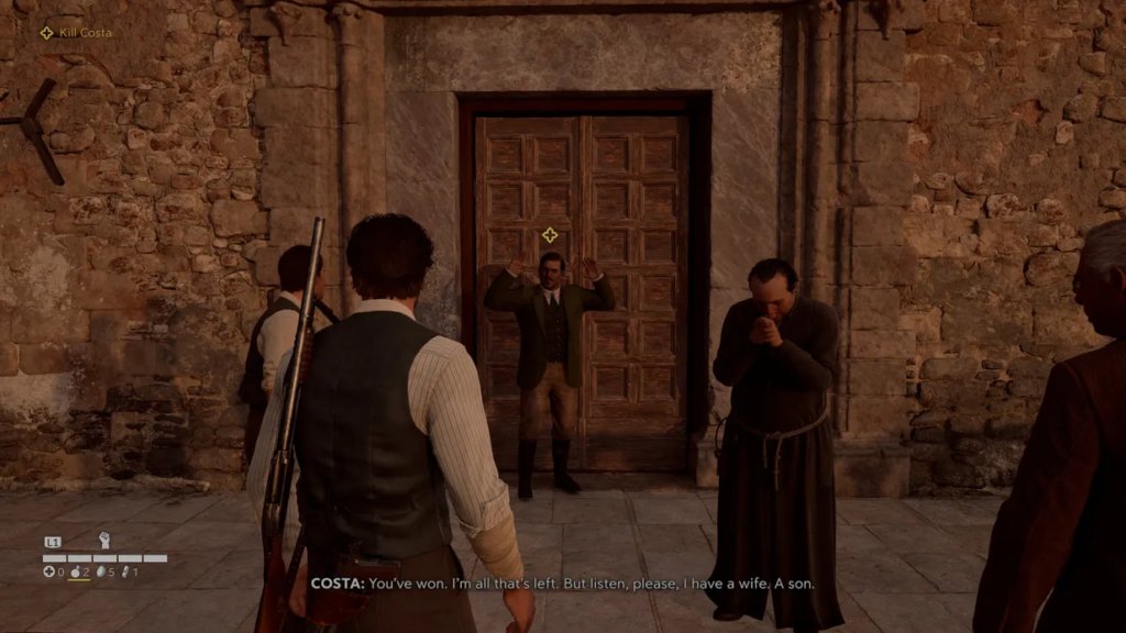 Man raising hands outside stone building doorway