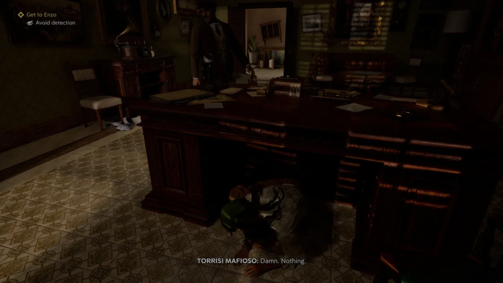 Man crouching under desk in office scene