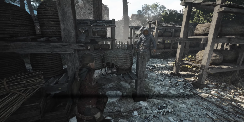 Amicia de Rune crouches behind baskets in A Plague Tale