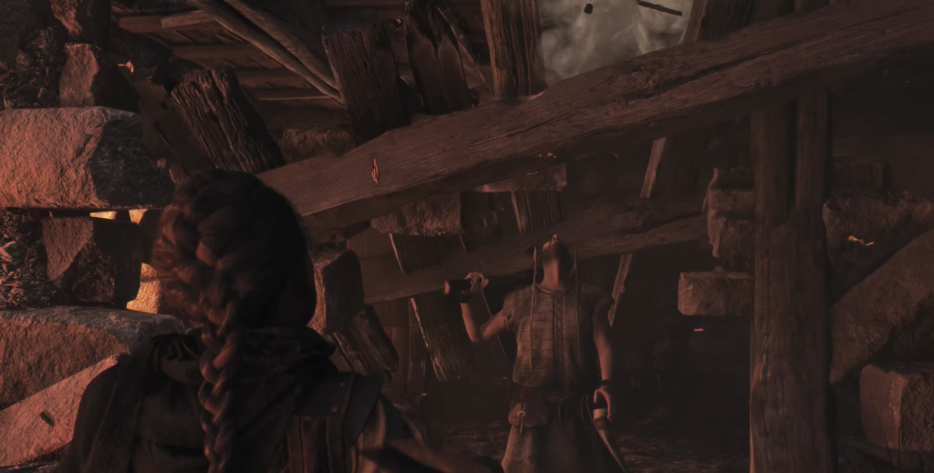 Person holding weapon amid collapsing wooden beams and rubble