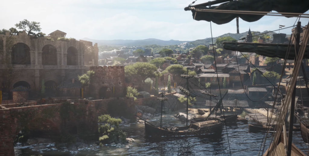 Sailing ships docked at medieval harbor town waterfront