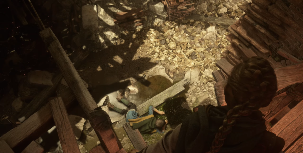 Girl looking down at boy in rubble pit