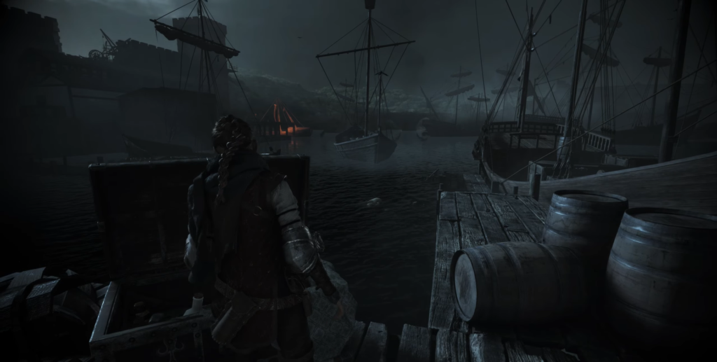 Amicia de Rune stands on dock beside ships at night