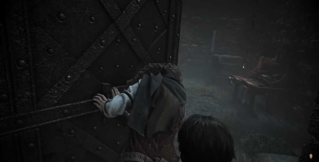 Girl pushes heavy door in dark room