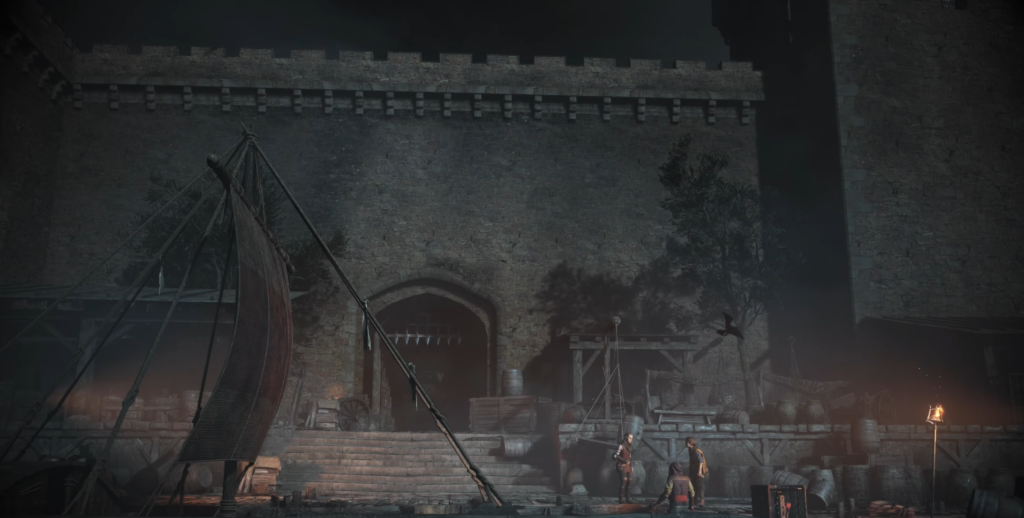 People standing near castle gate at night dock