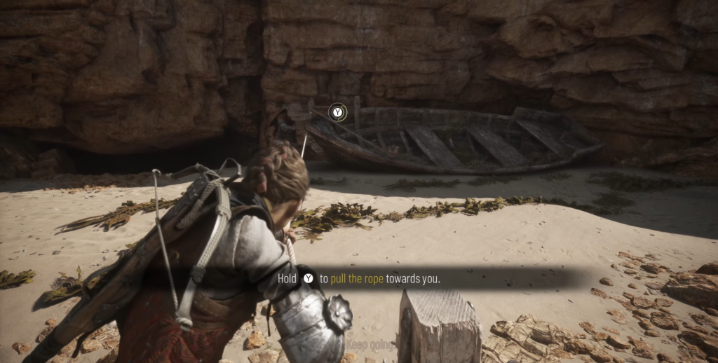 Amicia A Plague Tale pulling rope on beach.