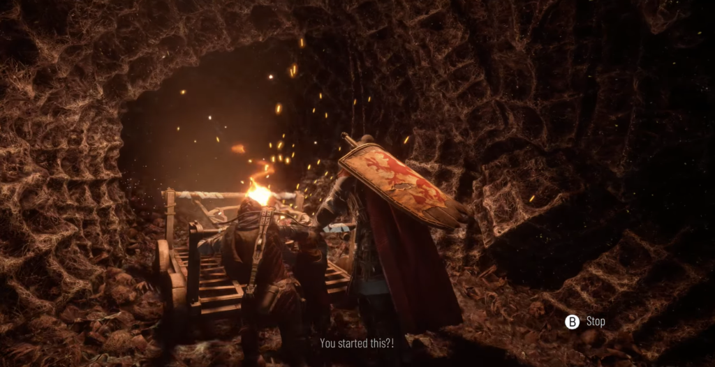 Knight pushing cart in dimly lit cave.