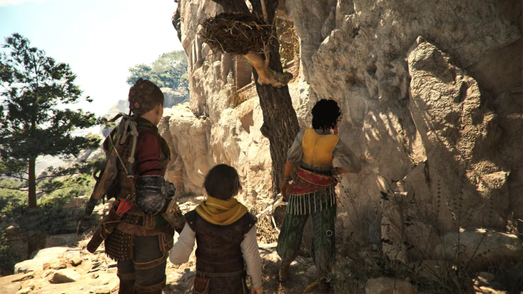 Characters exploring a rocky cliff in A Plague Tale.
