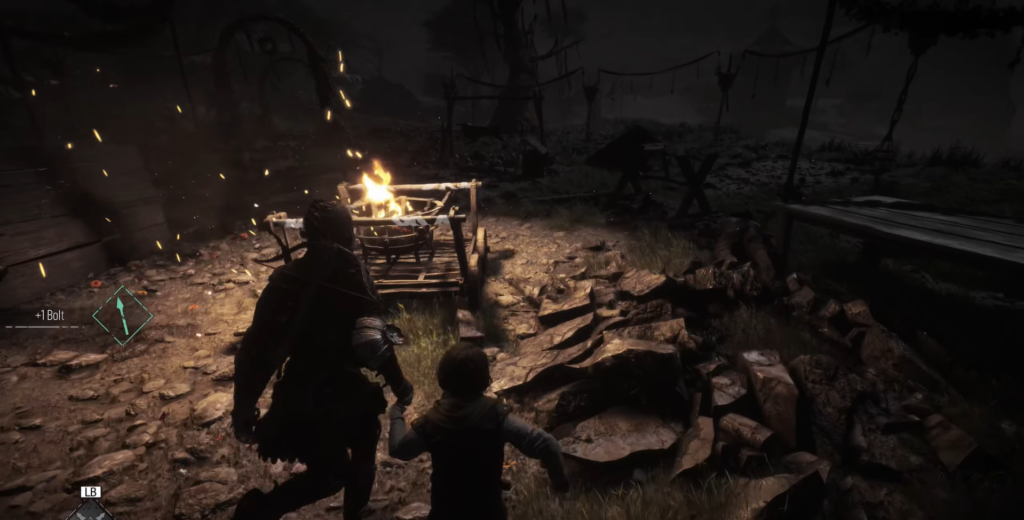 Man and child walking towards a campfire.