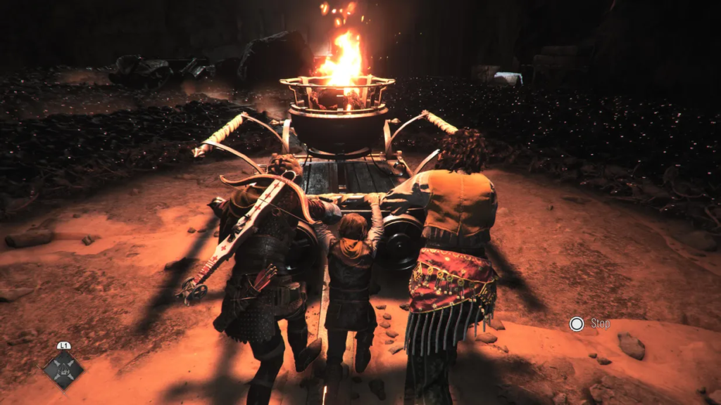 Three characters pushing a cart with fire.