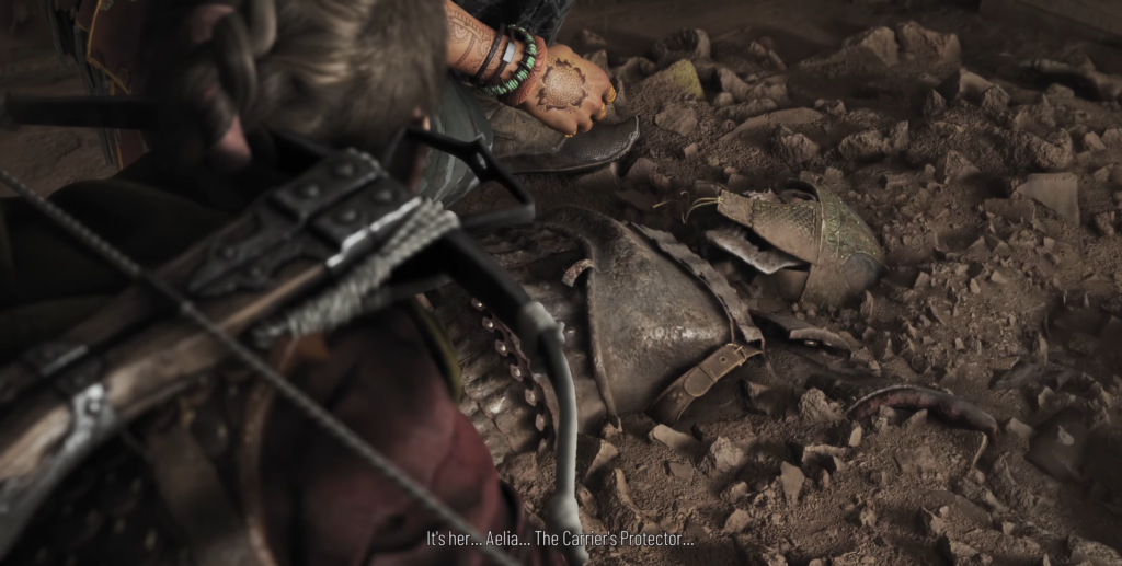 Character kneels beside broken armor on ground.