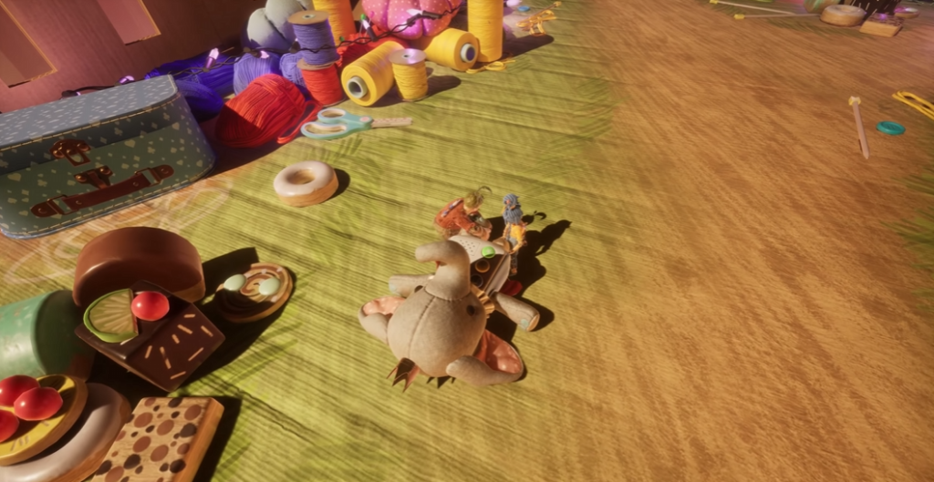 It Takes Two characters riding stuffed elephant on floor