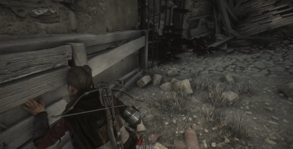 Girl hiding behind wooden fence.