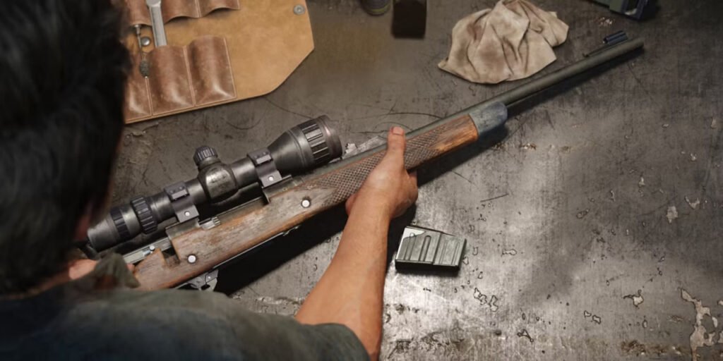 Hands holding scoped rifle on metal workbench