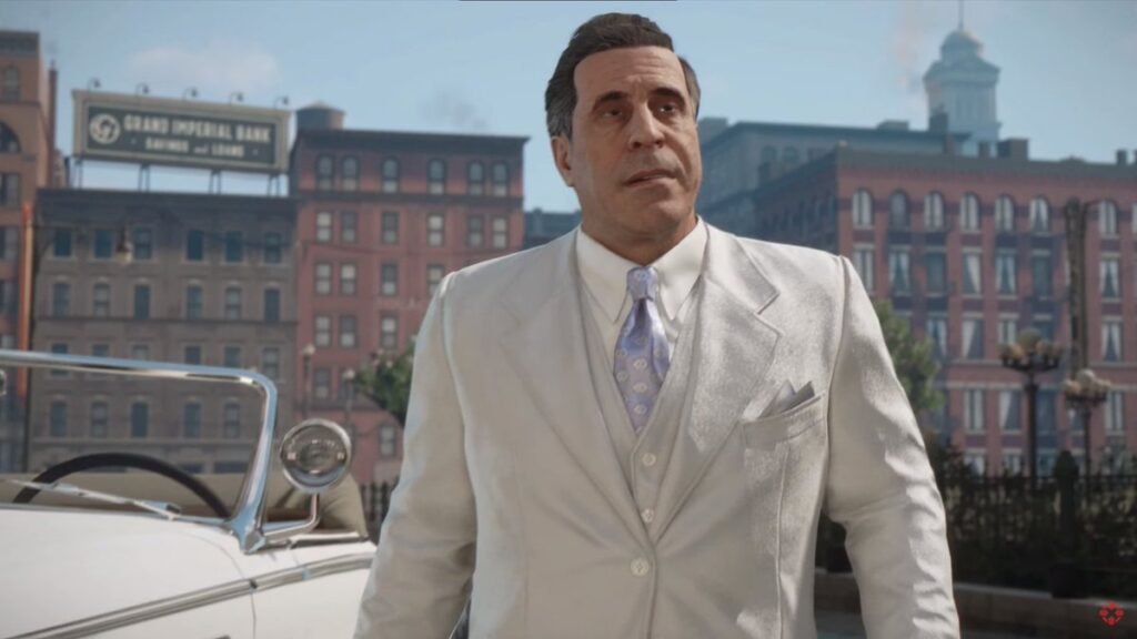 Man in white suit standing by car downtown
