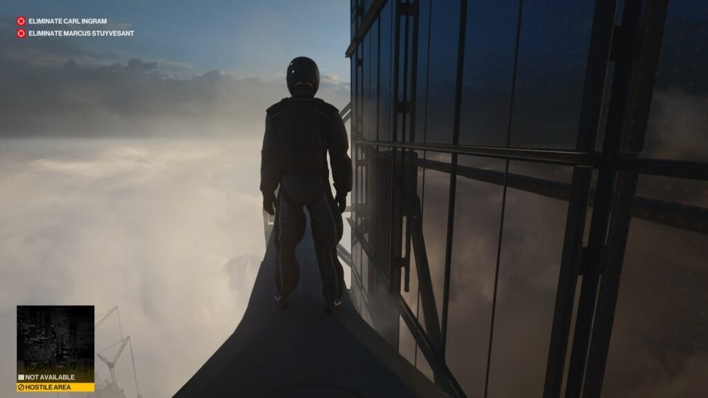 Hitman Agent 47 stands on rooftop beside building