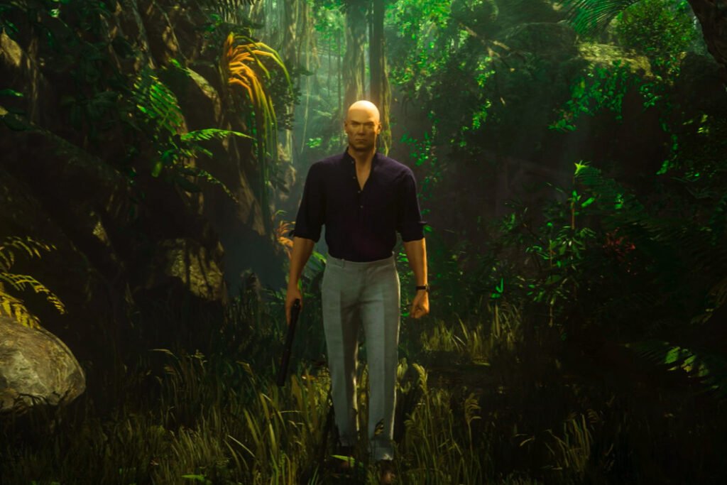Agent 47 from Hitman walking through jungle holding pistol