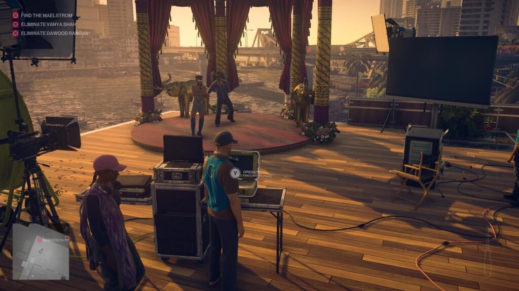 Hitman 2 Agent 47 watches dancers on riverside stage