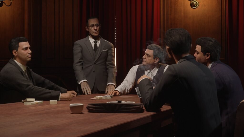 Men in suits play cards at table indoors