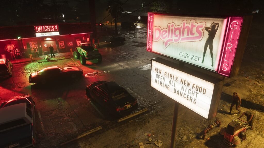 Cars parked outside Delights cabaret under pink neon sign